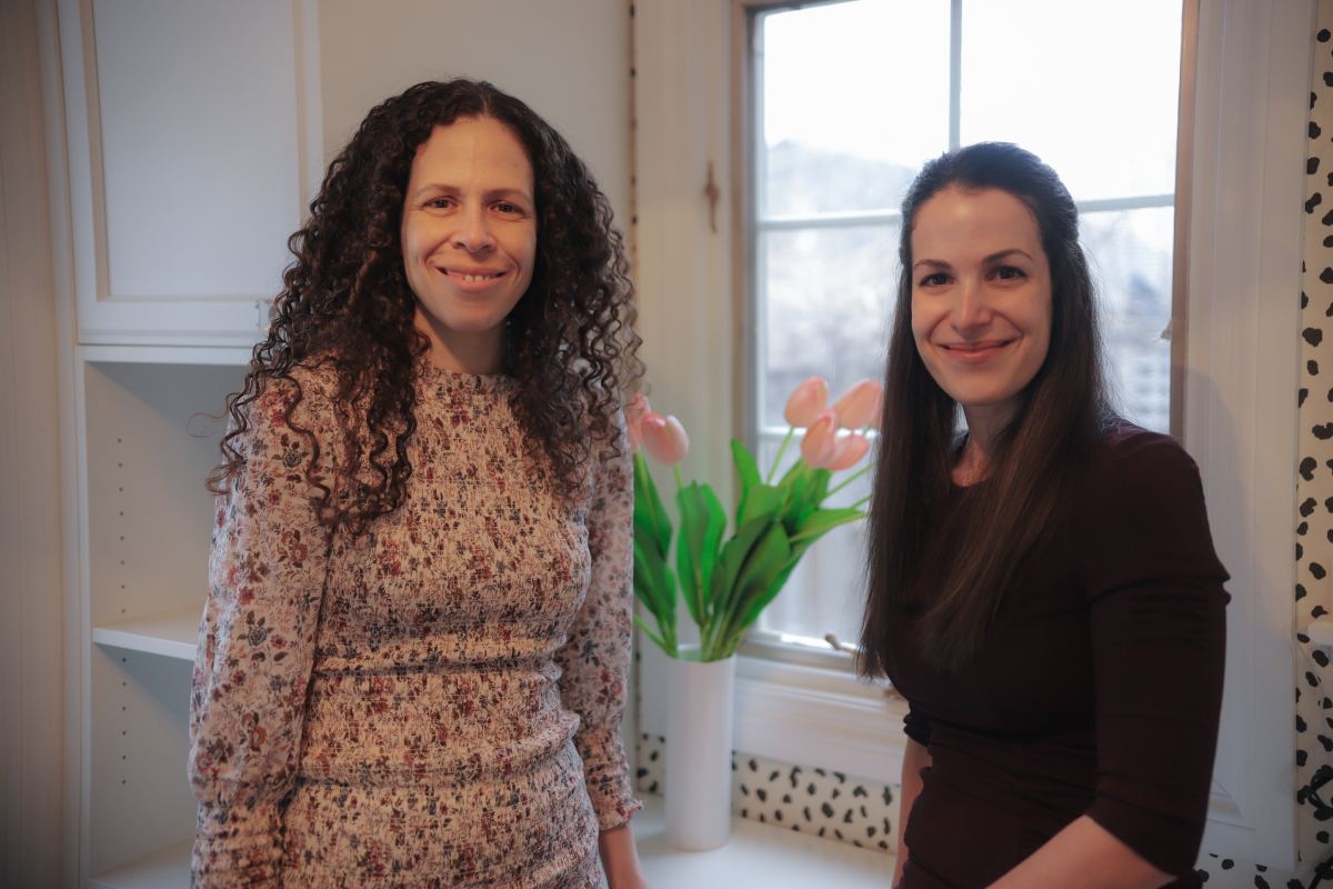 Nadia D'Iuso and Debora D'Iuso smiling next to each other