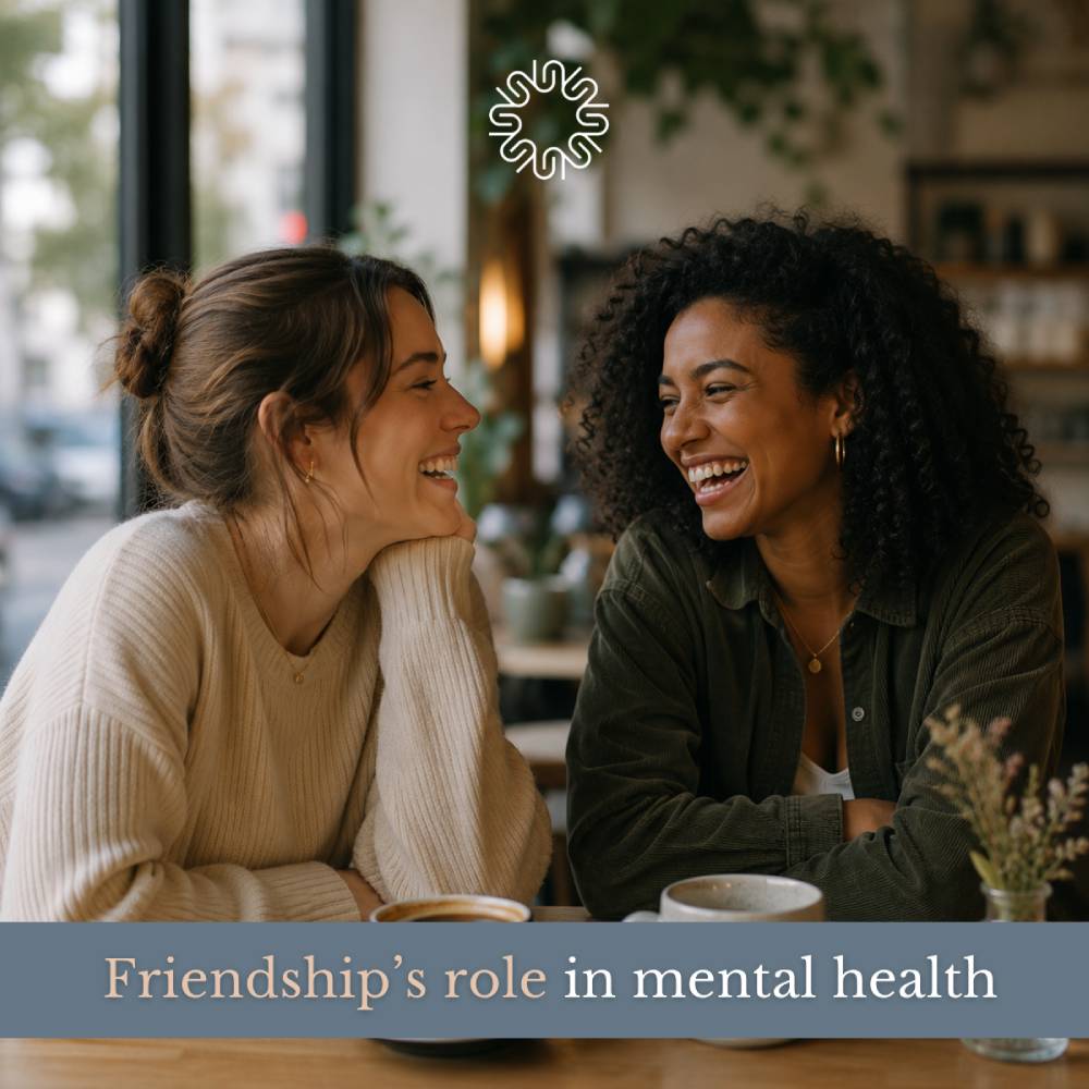 Two women laughing together over coffee with text reading Friendship’s role in mental health.